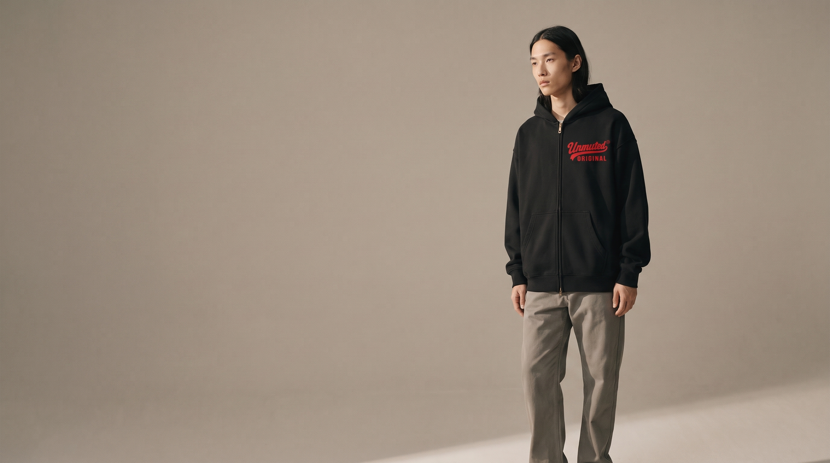 Model wearing the Unmuted Essential Boxy Hoodie