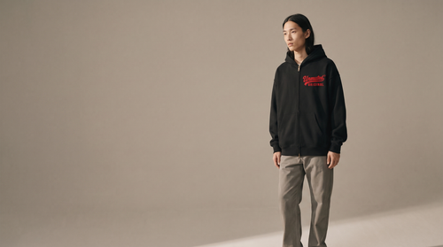 Model wearing the Unmuted Essential Boxy Hoodie