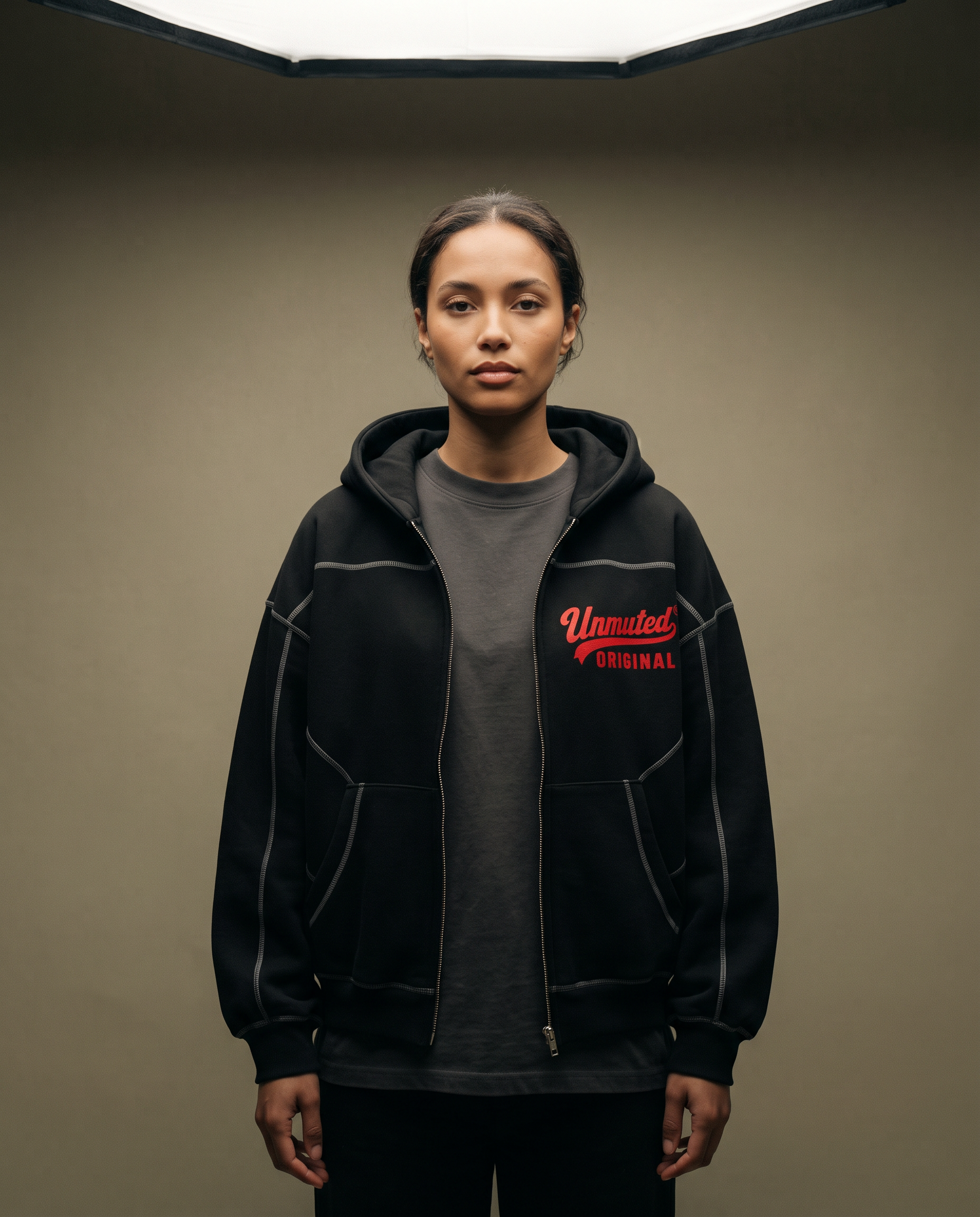 Model wearing the Unmuted Contrast-Stitch Zip Hoodie